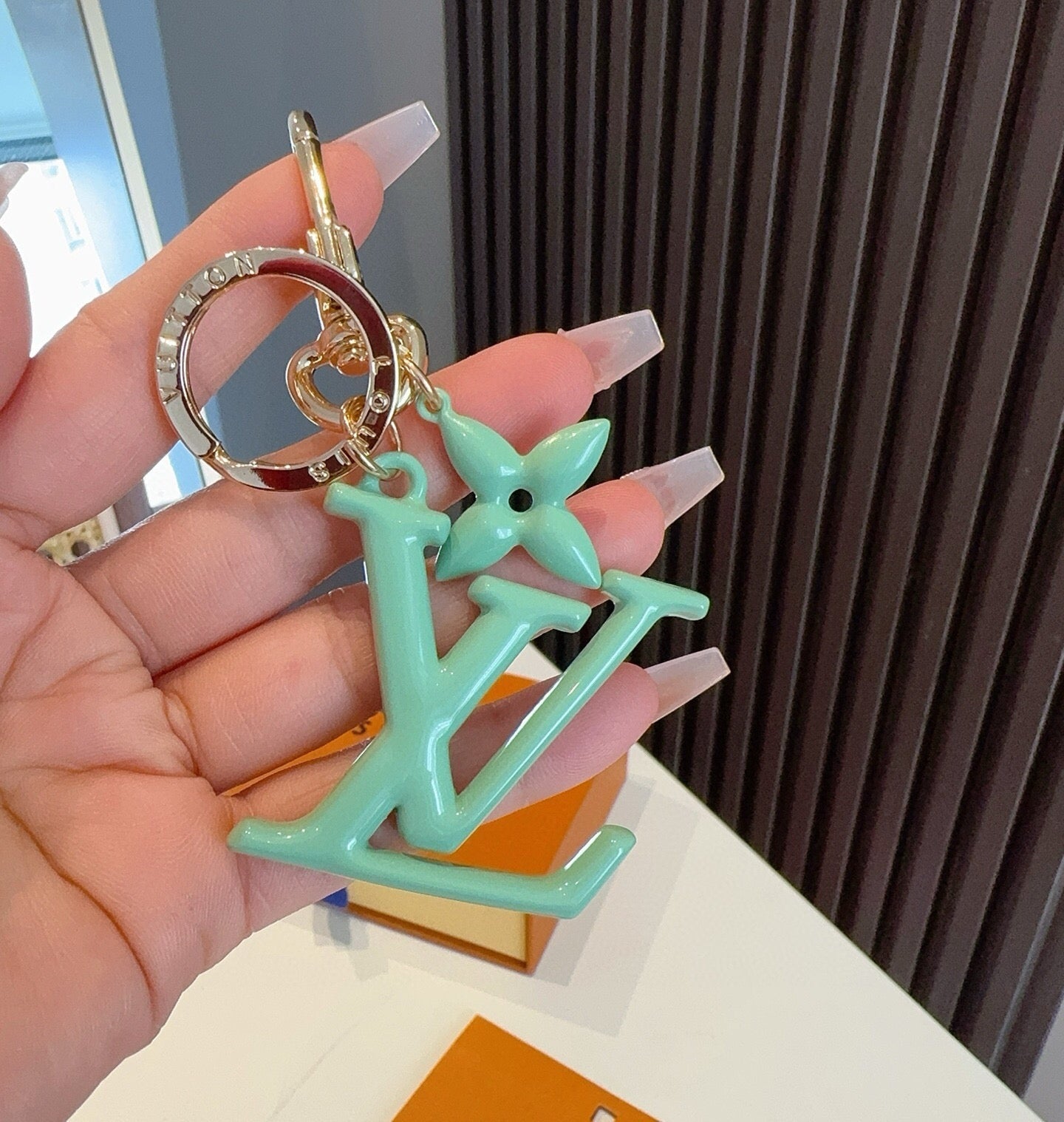 LV Logo Charm 415613