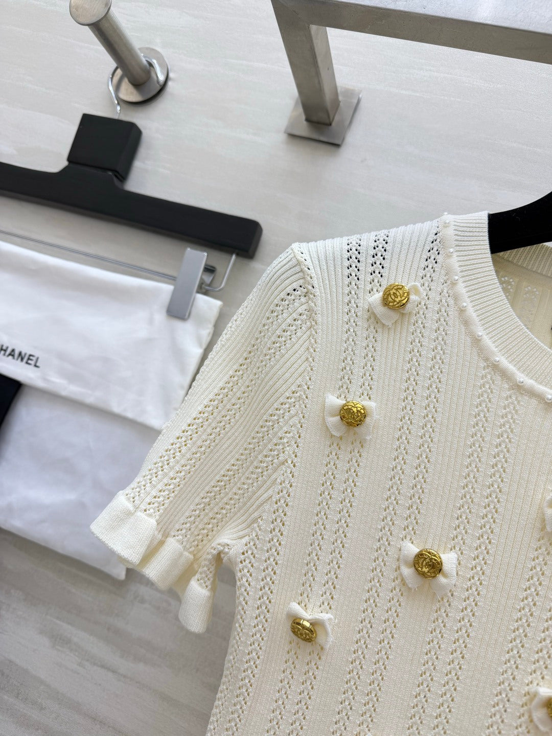 Chanel 2026 Gold Button Bow Short-sleeve Top Cream Cotton 394202